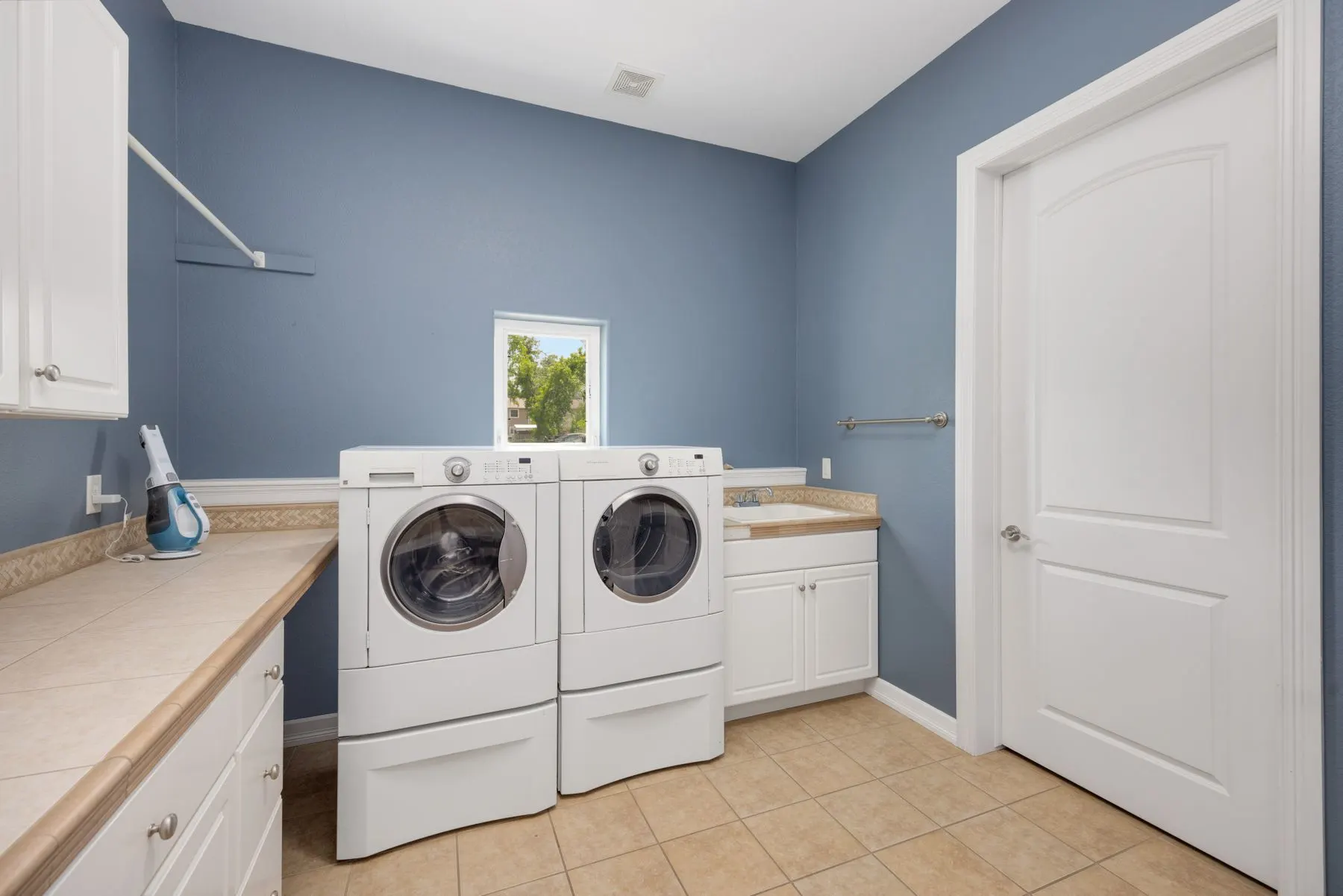 Bright laundry room with a washer and dryer
